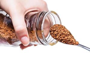 glass jar with coffee crystals and spoon isolated photo
