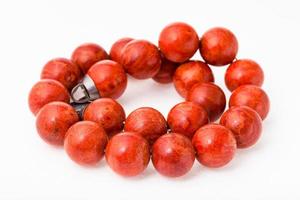 tangled necklace from polished red coral balls photo
