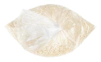 uncooked white rice in tied plastic bag isolated photo