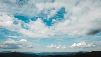 Green mountains of Carpathians in middle of forest against background of a dramatic sky photo