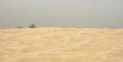 Sea sand beach summer day and water background photo