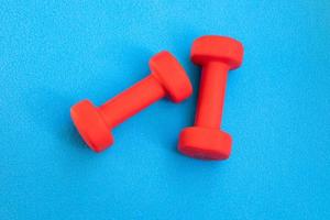 Women's small red dumbbells photo