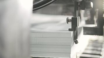 Printed sheets of paper are served in the printing press. Offset printing, CMYK video