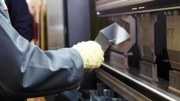 Hands of worker at automate machine on Industrial factory video