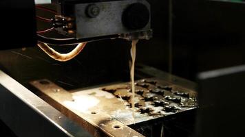 Laser processing at industry - cutting of metal. Sparks fly video