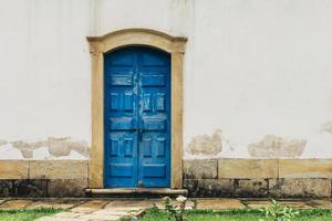 Blue vintage door at historic church in Ouro Preto, Brazil photo