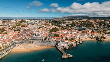 Panaromic drone aerial view of Cascais Bay, Portugal looking towards Ribeira Beach with Sintra mountains on background photo