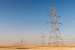 Giant electricity cables in the desert photo