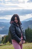 Portrait of happy cheerful beautiful young woman, outdoors. photo