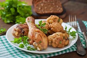 Chicken leg with baked cauliflower and parsley photo