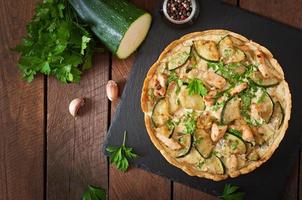 Quiche with chicken and zucchini with herbs photo