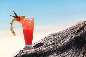 fruit cocktail on a tropical island beach photo