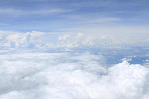 Airplane above clouds photo