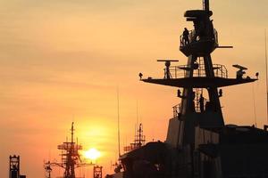 battleship with sunset behind photo