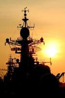 battleship with sunset behind photo