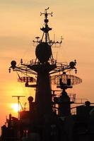 battleship with sunset behind photo