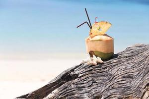 Coconut cocktail on the beach photo