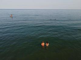 High Angle Sea View Beach Front with People at Bournemouth City of England UK, Aerial Footage of British Ocean photo