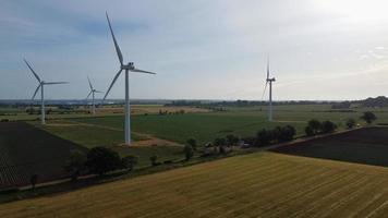 Aerial footage High Angle view of Green Energy natural Generators Sources of Wind turbines and solar panels Farms at England UK photo