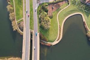 Gorgeous aerial footage and high angle view of British Lake and Roads with Water Birds photo