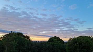 Beautiful and Colourful Sunset with Clouds on Sky photo