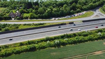 High Angle aerial view of British Roads and Traffic Passing through countryside of England UK photo