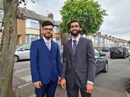 Young Males young Businessmen are Posing in a Street of Luton England UK photo