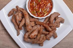 Sun-dried pork in a white plate photo