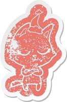 calm cartoon distressed sticker of a cat wearing santa hat vector