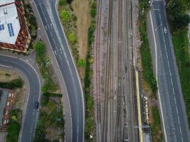 High Angle Footage of London Luton Town and Aerial view of Central Railway Station, Train Tracks of England UK photo