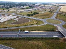 Aerial View and High Angle Footage of British Motorways Interchange of M1 Junction 11a at North Luton City of England UK. photo