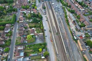 Aerial view of Luton Town with High Angle Footage of Train and Track Passing through city of England UK photo