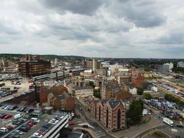 Aerial footage and high angle view of Train on Tracks at Central Luton Railway Station and City Centre of Luton Town of England UK photo