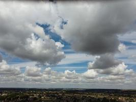 Most Beautiful Sky with Thick Clouds over British Town on a Hot Sunny Day photo