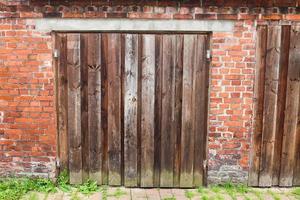 Very old wooden door on an old vintage house. photo