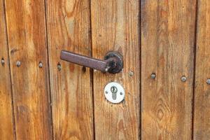 Very old wooden door on an old vintage house. photo