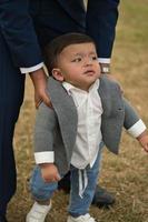 Asian Pakistani Father is holding his 11 Months Old Infant at Local Park photo