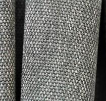Detailed close up view on samples of cloth and fabrics in different colors found at a fabrics market photo