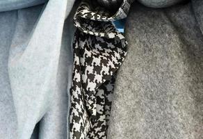 Detailed close up view on samples of cloth and fabrics in different colors found at a fabrics market photo