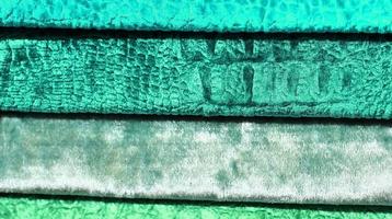 Detailed close up view on samples of cloth and fabrics in different colors found at a fabrics market photo