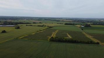 Aerial footage High Angle view of Green Energy natural Generators Sources of Wind turbines and solar panels Farms at England UK photo