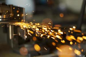 Grinding steel. Caviar from grinder. Circular saw. photo