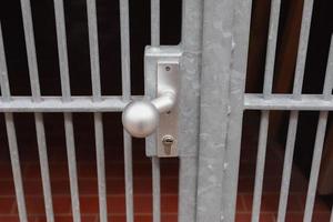 Close uo of a lock at a close metal gate. photo