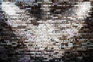 Aged and weathered brick wall textures with very bright spotlight illumination photo