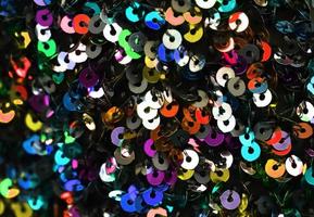 Detailed close up view on samples of cloth and fabrics in different colors found at a fabrics market photo