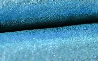 Detailed close up view on samples of cloth and fabrics in different colors found at a fabrics market photo