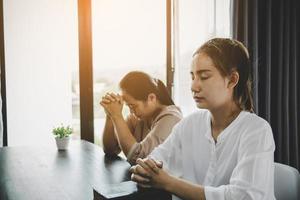 Two women praying worship believe photo