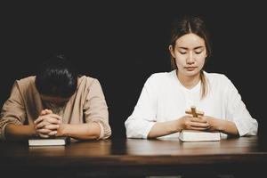 Two women praying worship believe photo