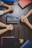 Group of people praying worship believe photo