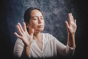 Woman Pray for god blessing to wishing have a better life photo